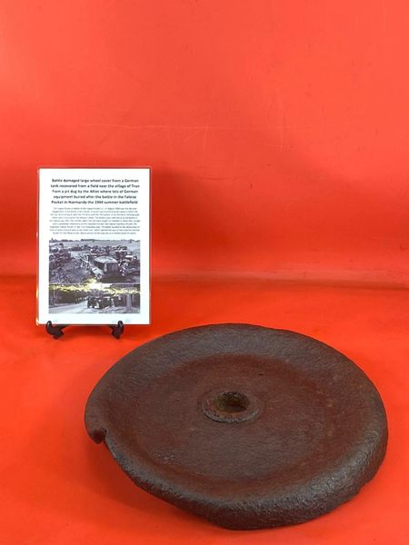 Battle damaged large wheel cover from a German tank or vehicle recovered from a field near Trun a pit dug by the allies where lots of German equipment buried after the battle in the Falaise Pocket, Normandy in France 1944