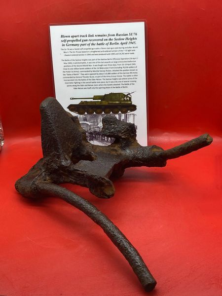 Blown apart track link which is half a link with pins from Russian SU76 self propelled gun recovered from the site of a destroyed SU76 gun from the battlefield on the Seelow Heights in 1945 the opening battle for Berlin
