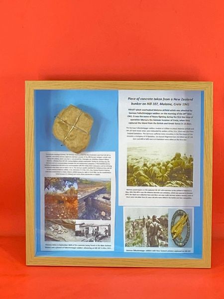 Large glass framed display a Piece of concrete from a New Zealand bunker on Hill 107 overlooking Maleme airfield captured by German Fallschirmjager soldiers in the battle of May 1941 on the Island of Crete