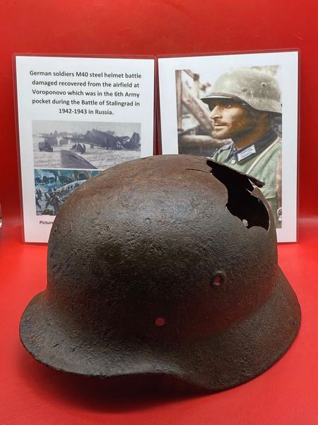 German soldiers fantastic condition M40 Helmet with green paint remains,battle damaged recovered from the airfield at Voroponovo which was in the 6th Army pocket during the Battle of Stalingrad in 1942-1943.