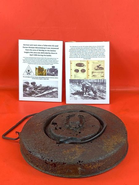 German anti-tank mine a Tellermine 42 with some original sand and red colour paintwork used by Panzer Division Muncheberg recovered in the Werbig area on the Seelow heights this was the area defended by them, April 1945 battlefield