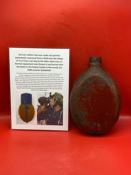 German army issue red painted water bottle, nice relic lots of original paintwork recovered from a field near Trun a pit dug by the allies where lots of German equipment buried after the battle in the Falaise Pocket, Normandy in France 1944