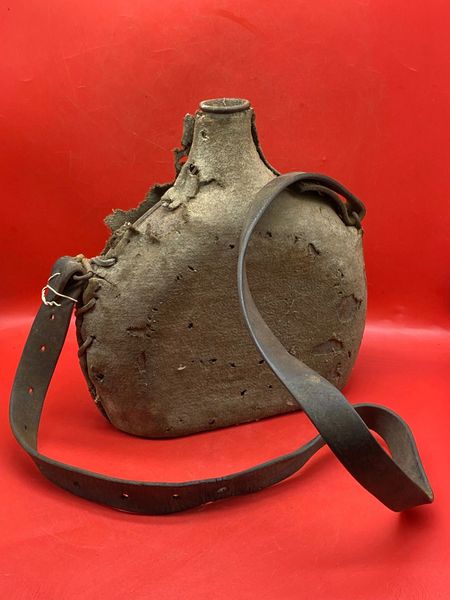 French soldiers water bottle complete with its cloth gray cover+leather strap from a private collection in Dunkirk so left over from the Dunkirk pocket of 1940