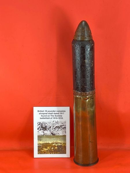 Nice condition complete British 18 pounder shrapnel shell with battlefield recovered steel shell case painted black,brass case dated 1917 found on the Somme battlefield of 1916-1918.