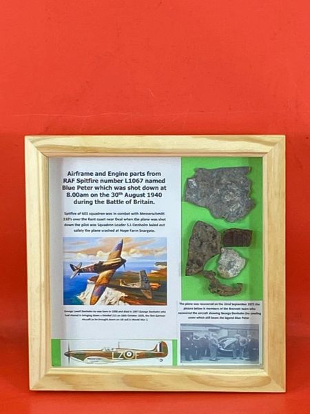 Glass framed airframe and engine parts from RAF Spitfire number L1067 named Blue Peter which was shot down on the 30th August 1940 and crashed at Snargate in Romney Marsh in Kent during the battle of Britain