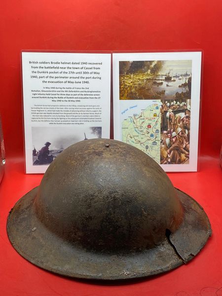 British soldiers Brodie Helmet maker stamped dated 1940,battle damaged with some paintwork recovered near the town of Cassel the battle fought from 27th until 30th of May 1940 part of the Dunkirk pocket perimeter in France.