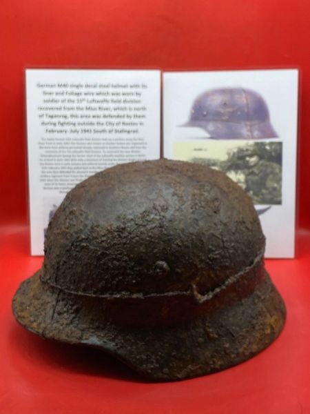 Very rare German M40 single decal steel helmet with complete liner,and decal with foliage wire worn by soldier in 15th Luftwaffe field division recovered from the Mius River north of Taganrog defended by them in fighting at Rostov in 1943 near Stalingrad.