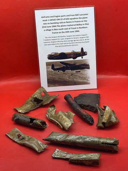 Group of clean Airframe and Engine parts with lots of paint remains from RAF Lancaster bomber number LM102 of 626 squadron on a raid on Reims shot down on 23rd June 1944 over France