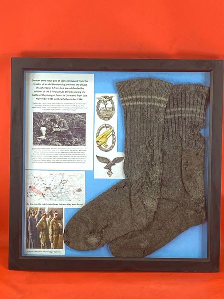 Glass framed Very rare German army issue socks solid,original colours recovered from old German dug out near the village of Lucherberg,defended by soldiers of the 3rd Parachute Division during the battle of the Hurtgen Forest,November-December 1944.