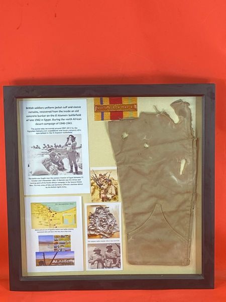 Very rare glass framed British soldiers uniform jacket remains which is the bottom of a sleeve recovered inside a concrete bunker on the El Alamein battlefield used during the North African desert campaign of 1940-1943.