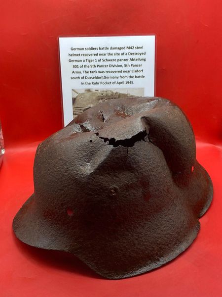 German soldiers battle damaged M42 steel helmet solid relic recovered near the site of destroyed German Tiger 1 Tank from a tank of Schwere Panzer Abteilung 301,9th Panzer Division recovered near Elsdorf,Ruhr Pocket April 1945