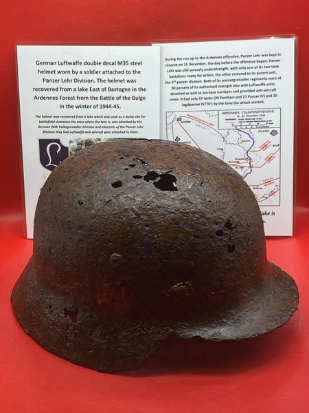 German Luftwaffe double decal M35 steel helmet,solid relic-both decals still there that was worn by a soldier attached to the Panzer Lehr Division, recovered from a lake East of Bastogne in the Ardennes Forest,Battle of the Bulge in the winter of 1944-45.