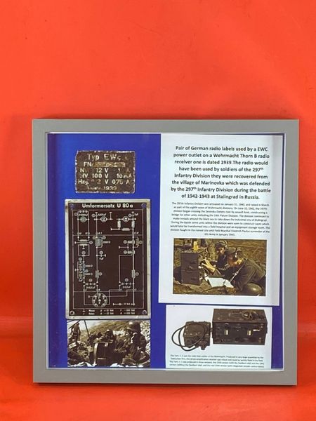 Glass box framed Pair of German radio labels used by a EWC power outlet on a Wehrmacht Thorn B radio receiver one is dated 1939,used by soldiers of the 297th Infantry Division,recovered from the village of Marinovka, battle of 1942-1943 at Stalingrad