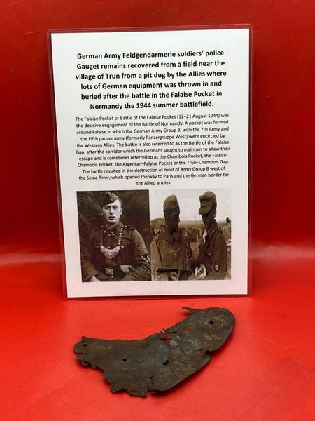 German feldgendarmerie soldiers Police Gauget remains with paintwork recovered from a field near Trun a pit dug by the allies where lots of German equipment buried after the battle in the Falaise Pocket, Normandy in France 1944