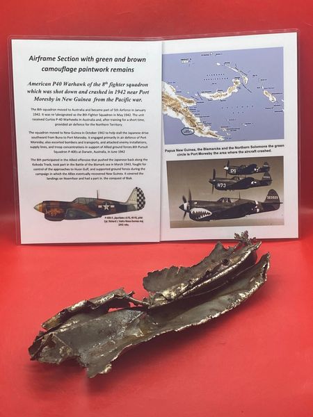 Very rare large aluminium airframe section with green and brown paint remains and green undercoat on the other side very clear to see from American P40 Warhawk of 8th fighter squadron,shot down in 1942 near Port Moresby in New Guinea from the Pacific war.