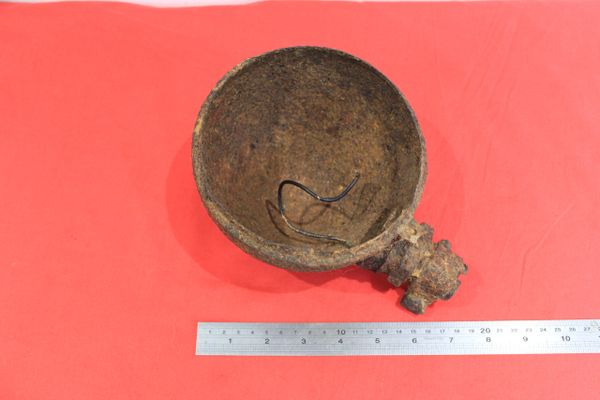 German vehicle headlight recovered from a field near Trun in a pit dug by the allies where lots of German equipment was buried after the battle in the Falaise Pocket, Normandy in France 1944