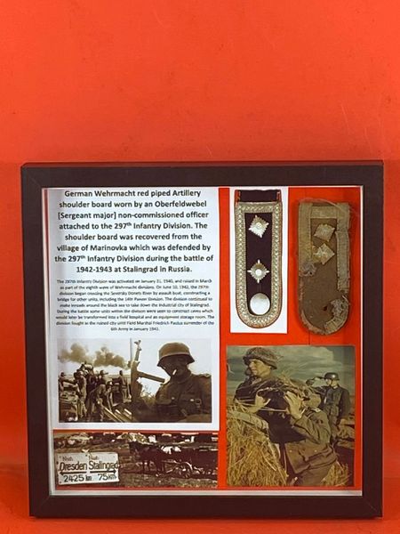 Very rare glass framed German Wehrmacht red piped artillery non commissioned officer shoulder board worn by a soldier of the 297th Infantry Division,recovered from the village of Marinovka, battle of 1942-1943 at Stalingrad