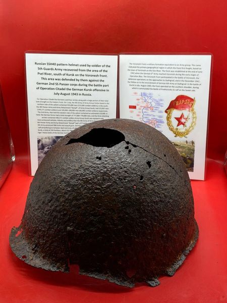 Battle damaged Russian SSh40 Helmet worn by soldier of the 5th Guards Army solid relic with green paintwork remains recovered from Psel River area,south of Kursk defended by them against German 2nd SS Panzer corps in Kursk offensive in July-August 1943