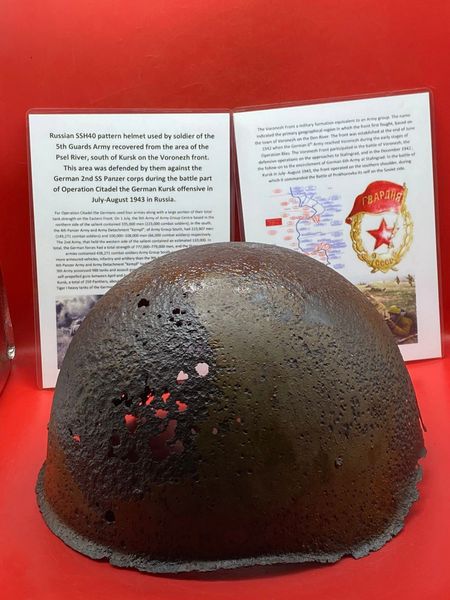 Russian SSh40 Helmet worn by soldier of the 5th Guards Army solid relic condition,lots of green paintwork that was recovered from Psel River area,south of Kursk defended against German 2nd SS Panzer corps during the Kursk offensive in July-August 1943