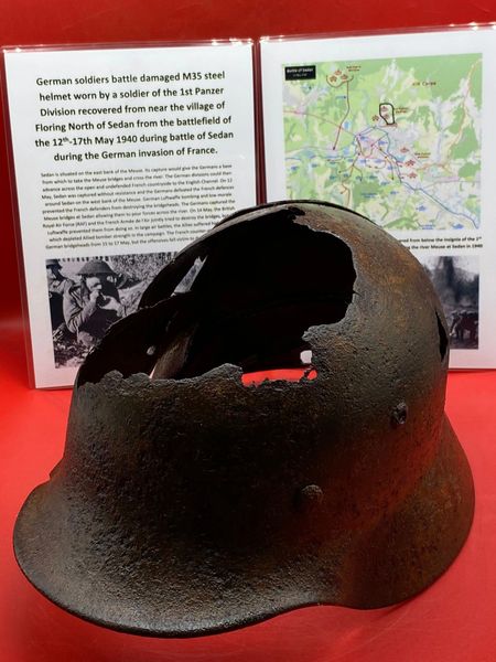 Fantastic condition relic German M35 pattern Helmet with lots of original green paintwork and liner ring, battle damaged worn by soldier of the 1st Panzer Division recovered near Sedan the battlefield of the 12th-17th May 1940 during battle of France