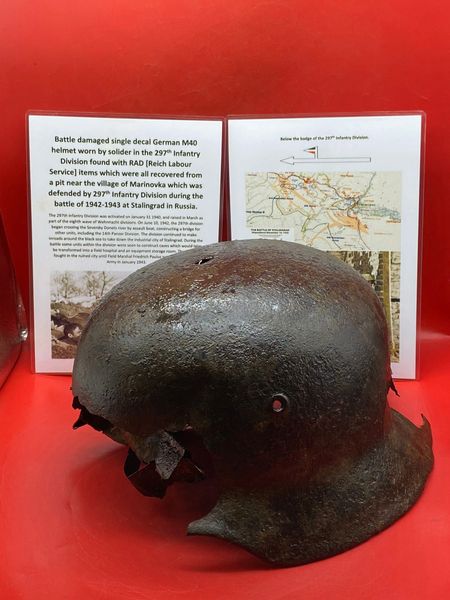 German M40 steel helmet battledamaged, lots of original green paintwork remains worn by a soldier of the 297th Infantry Division recovered from a pit in the village of Marinovka, defended by them during the battle of 1942-1943 at Stalingrad