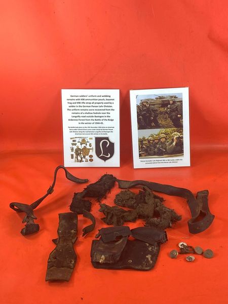 Uniform and webbing remains and rifle strap belonging to German soldier of the Pazer Lehr Division recovered from shallow foxhole in the area of the Longvilly road near Bastogne in the Ardennes Forest from battle of the Bulge 1944-1945