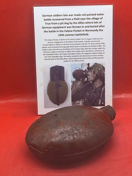 German army issue red painted water bottle, nice relic lots of original colour paintwork recovered from a field near Trun a pit dug by the allies where lots of German equipment buried after the battle in the Falaise Pocket, Normandy in France 1944