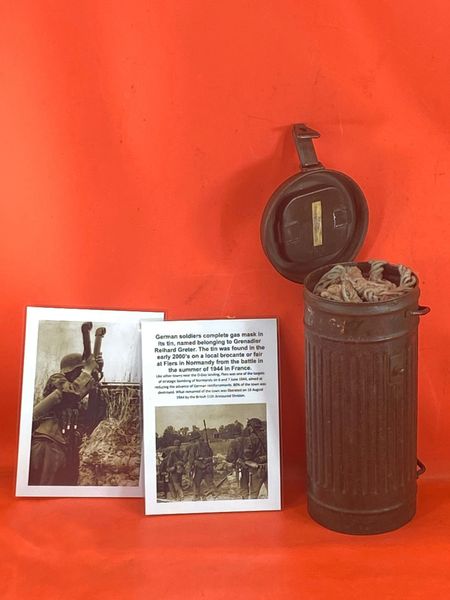 German soldiers complete gas mask in its tin, named belonging to Grenadier Reihard Greter. The tin was found in the early 2000’s on a local brocante or fair at Flers in Normandy from the battle in the summer of 1944 in France.