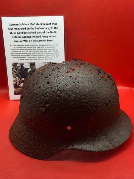 Solid condition relic German soldiers M40 steel helmet with green paintwork remains recovered from Seelow Heights 1945 battlefield the opening battle for Berlin