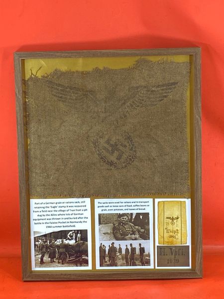 Glass framed Part of a German grain or rations sack, still retaining the ‘Eagle’ stamp it was recovered from field near the village of Trun from a pit where lots of German equipment found after the battle in the Falaise Pocket in Normandy,1944