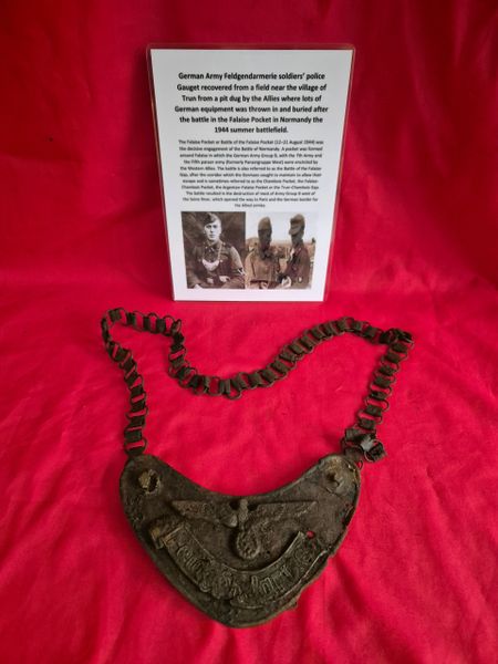 German feldgendarmerie soldiers Police Gorget recovered from a field near Trun in a pit dug by the allies where lots of German equipment was buried after the battle in the Falaise Pocket, Normandy in France 1944