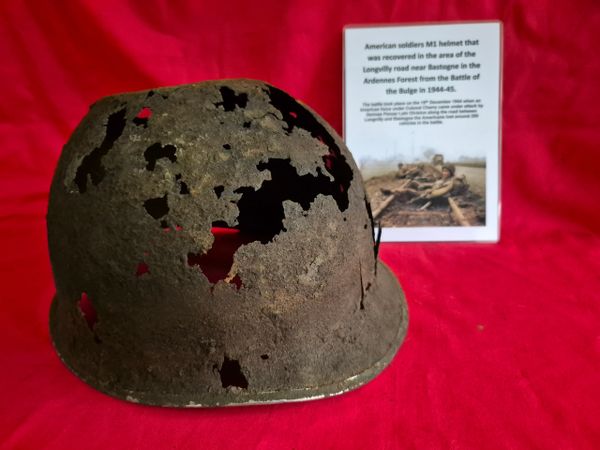 American helmet recovered from the woods in the area of the battle on the longvilly road - 19th December 1944.Battle of the Bulge