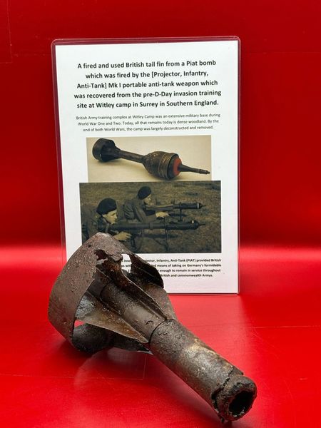 A fired and used British tail fin from a Piat bomb with original paintwork remains,fired by the [Projector, Infantry, Anti-Tank] Mk I portable anti-tank weapon which was recovered from the pre-D-Day invasion training site at Witley camp in Surrey