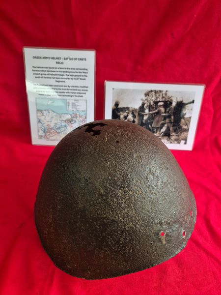 Greek army helmet from the battle of Crete. It was found on a farm in the area of Galatas which had been in the landing zone for the Mars assault group of Fallschirmjager. Has been used post war as a scoop and also been repaired by the farmer.