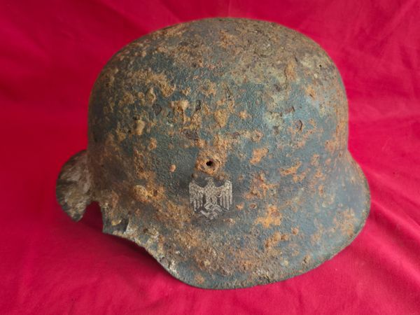 German Wehrmacht M42 steel helmet worn by a soldier in the 4th panzer army. Recovered from the Dom river area, lost in the battles of November - December 1942-1943 outside Stalingrad Russia.