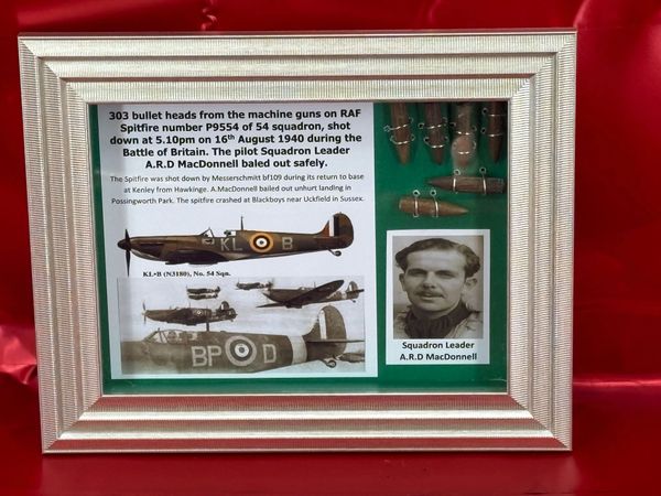 Glass framed group of 303 bullet heads nice brass colour still from RAF Spitfire number P9554 shot down on 16th August 1940 the pilot Squadron Leader A.R.D MacDonnell baled out and the plane crashed at Blackboys, Uckfield in Sussex.