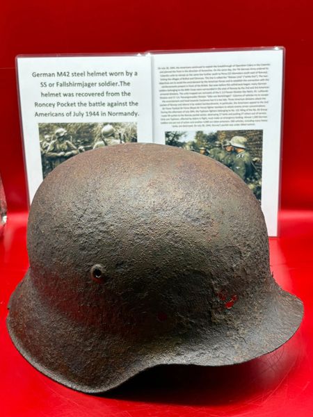 Very nice condition relic German M42 steel helmet with lots of original green paintwork remains used by a SS or Fallshirmjager soldier it was recovered from the Roncey Pocket the battle in July 1944 in Normandy.