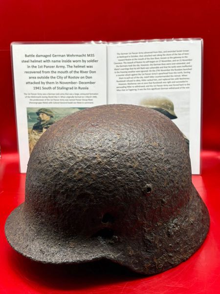 German Wehrmacht M35 steel helmet with impact holes,named inside used by soldier of the 1st Panzer Army recovered from the mouth of the River Don area outside the City of Rostov on Don attacked by them in November- December 1941 South of Stalingrad