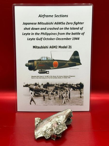 Very rare clean aluminium airframe section with 2 tone green camouflage paintwork remains from Japanese Mitsubishi A6M5a Zero fighter shot down and crashed on the Island of Leyte in the Philippines,battle of Leyte Gulf October-December 1944