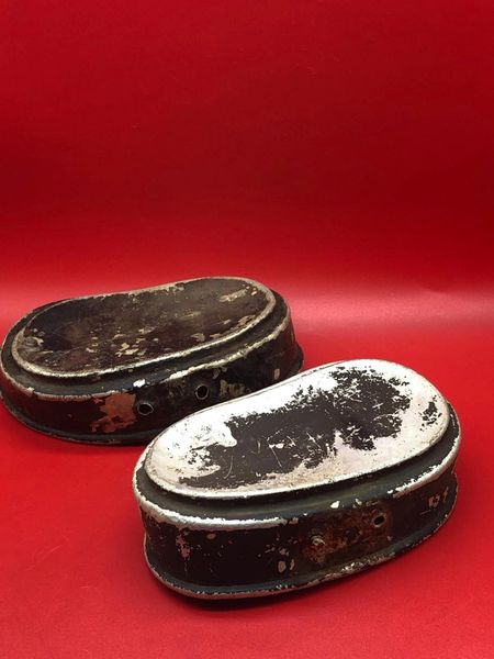 German soldiers aluminium mess tin lids with black paintwork remains used by soldier of the 132nd Infantry Division recovered on the Sevastopol battlefield in the Crimea 1941- 1942