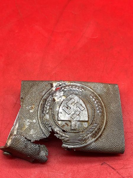 German RAD [Reich Labour Service] soldiers near complete aluminum belt buckle with badge recovered in the area of the village of Marinovka which was defended by the 297th Infantry Division during the battle of 1942-1943 at Stalingrad in Russia.