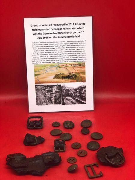 Group of British and German soldiers jacket buttons , leather sections, webbing clips and parts all recovered in 2014 from field opposite Lochnagar mine crater at La Boisselle on the 1st July 1916 Somme battlefield