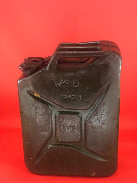 British fuel can or better known the famous Jerry can dated 1943,maker marked with original green paintwork overpainted the sand camouflage paint from Museum closed down in 2015 on the battlefield at Monte Cassino in Italy