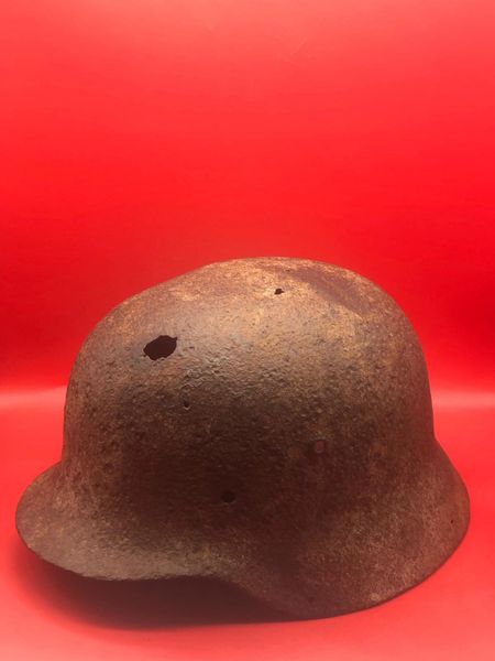 German soldiers M40 steel helmet solid relic possibly white paint remains found with tanks parts from Panzer 4 tank of the 6th SS Panzer Army recovered from the battlefield outside Vienna in April 1945