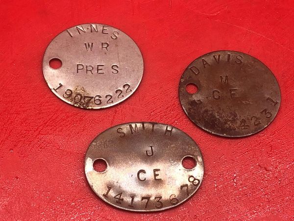 3 British soldiers complete dog tags aluminium made nice clear markings these were manufactured in 1945 for soldiers who were being sent out to the far East against Japan but were not sent because of atomic bombs being dropped