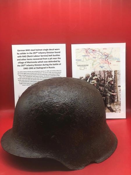 Fantastic condition German M42 steel helmet lots of paintwork with single decal worn by soldier of 297th Infantry Division recovered with Reich Labour Service items from the village of Marinovka, defended by them during the battle of 1942-1943, Stalingrad