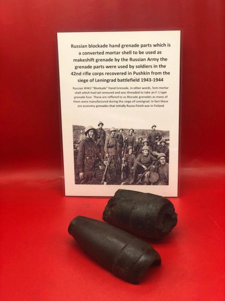 Blown in half Russian blockade hand grenade parts still with black paintwork remains used by soldiers in the 42nd rifle corps recovered in Pushkin from the siege of Leningrad battlefield 1943-1944