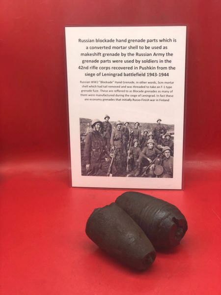 Blown in half Russian blockade hand grenade parts still with black paintwork remains used by soldiers in the 42nd rifle corps recovered in Pushkin from the siege of Leningrad battlefield 1943-1944