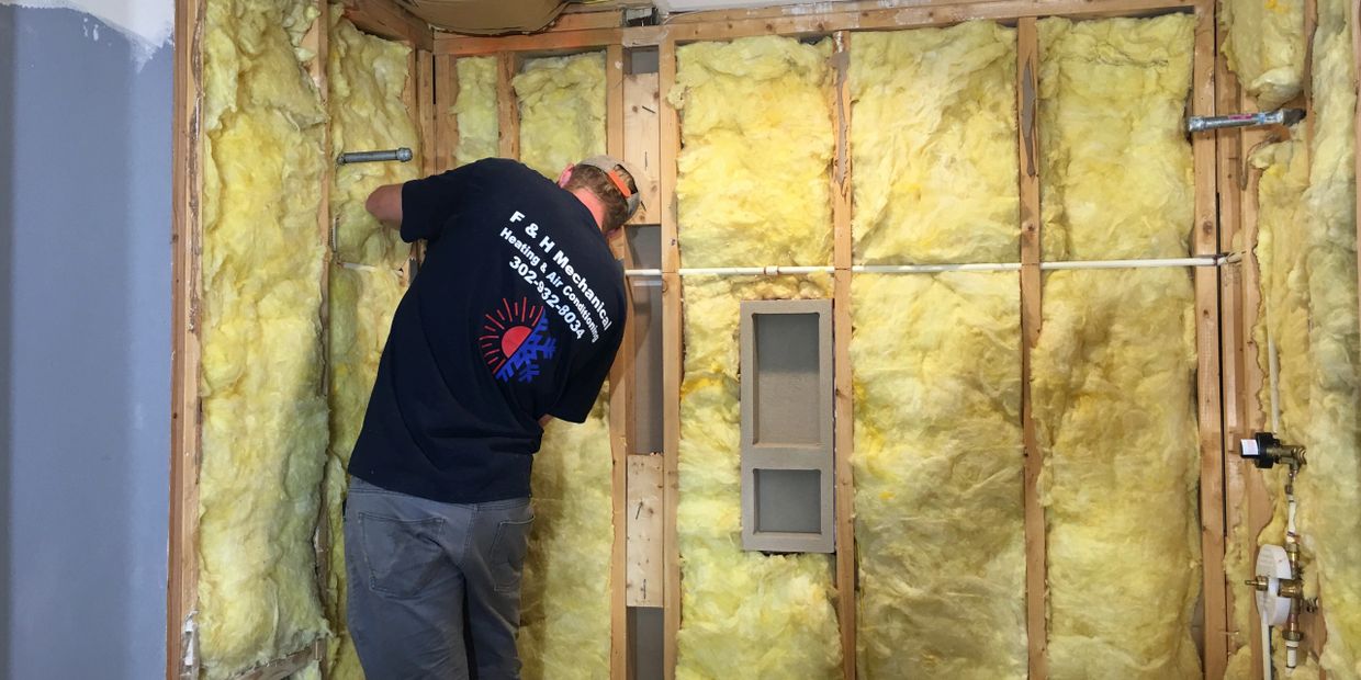 F&H Mechanical employee provides HVAC services in a residence in New Castle County, DE.
