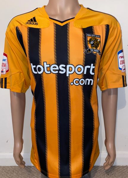 2010/11 MATCH ISSUE AND SIGNED HULL CITY HOME SHIRT (BOSTOCK #12)